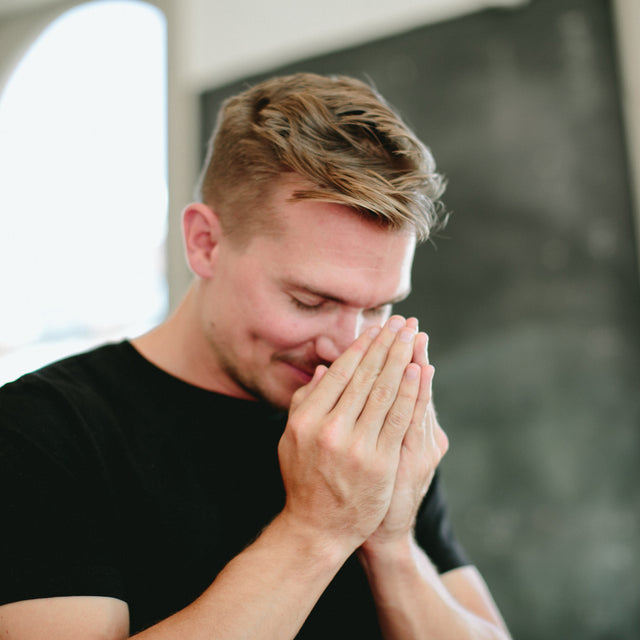 A man doing a Saje breath with super detox cleansing remedy roll-on 