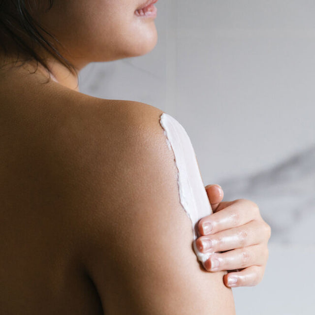 A person applying Tantra Sensuous coconut and shea body butter to their arm 